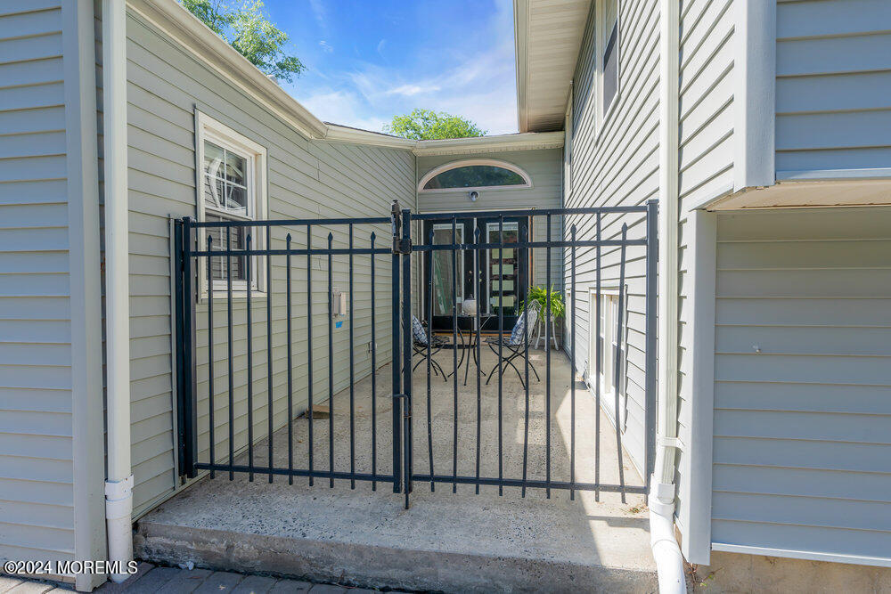 9 Comanche Drive Middletown, NJ 07716 - Photo 50 of 69 a view of a house with a door and wooden floor