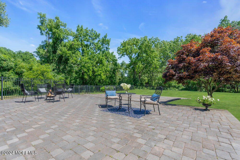 9 Comanche Drive Middletown, NJ 07716 - Photo 53 of 69 a view of backyard with seating area and green space