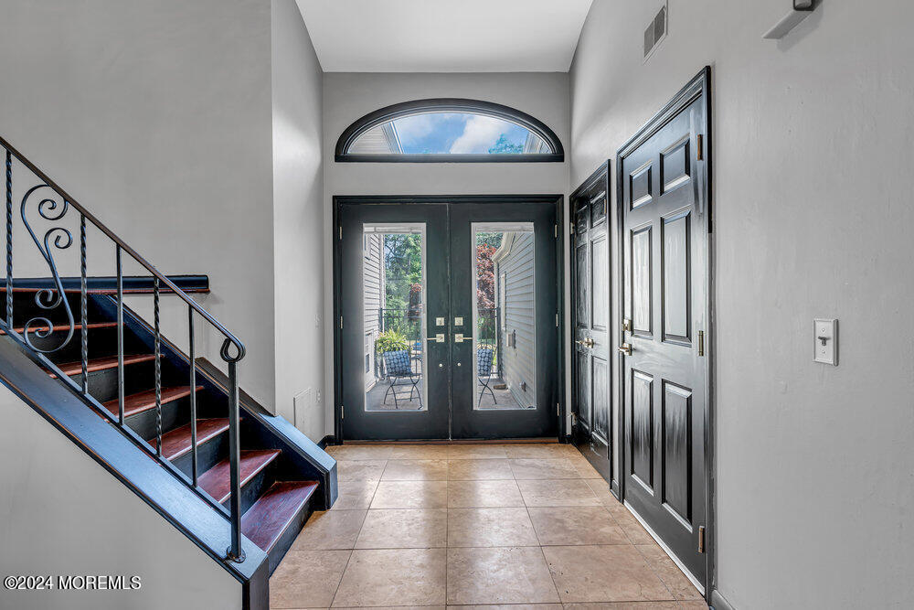 9 Comanche Drive Middletown, NJ 07716 - Photo 8 of 69 a view of a hallway with entryway and stairs