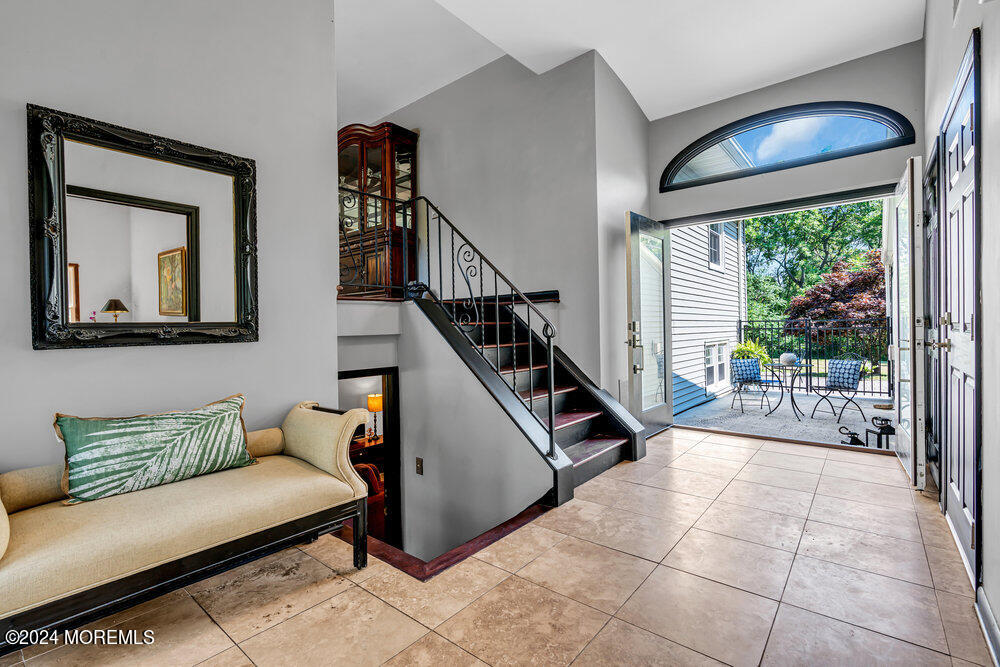 9 Comanche Drive Middletown, NJ 07716 - Photo 10 of 69 a living room with furniture and a painting on the wall