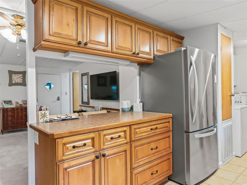 16160 Southeast 97th Terrace Road Summerfield, FL 34491 - Photo 13 of 39 a kitchen with stainless steel appliances granite countertop a refrigerator and a sink