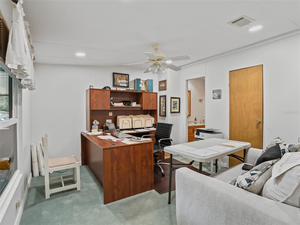 16160 Southeast 97th Terrace Road Summerfield, FL 34491 - Photo 19 of 39 a living room with furniture and a table