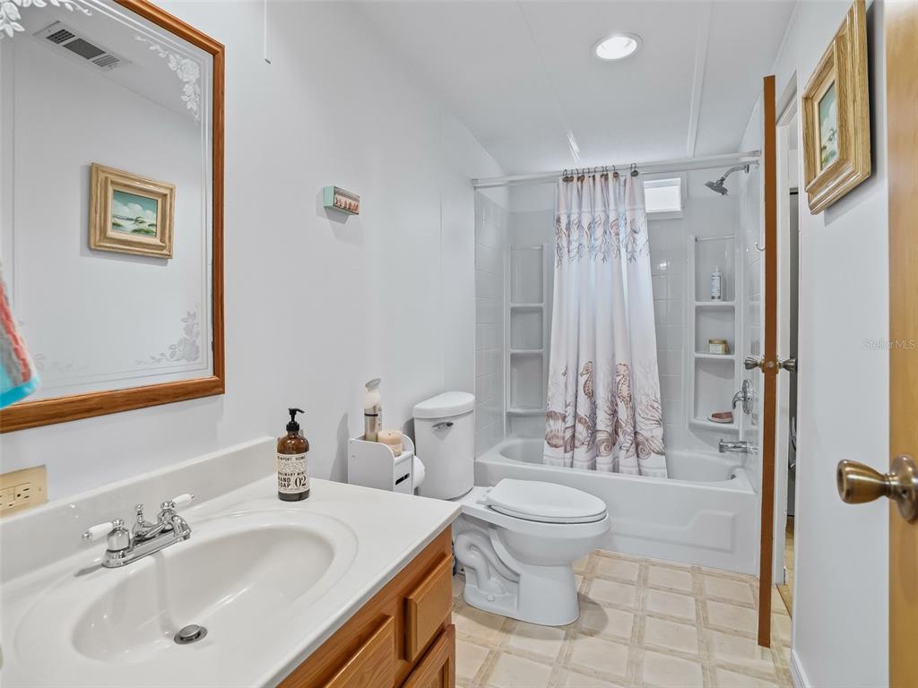16160 Southeast 97th Terrace Road Summerfield, FL 34491 - Photo 20 of 39 a bathroom with a sink toilet and shower