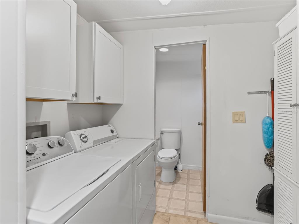 16160 Southeast 97th Terrace Road Summerfield, FL 34491 - Photo 21 of 39 a utility room with dryer and washer
