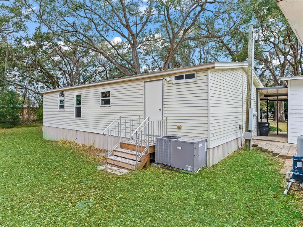 16160 Southeast 97th Terrace Road Summerfield, FL 34491 - Photo 22 of 39 a view of a house with backyard