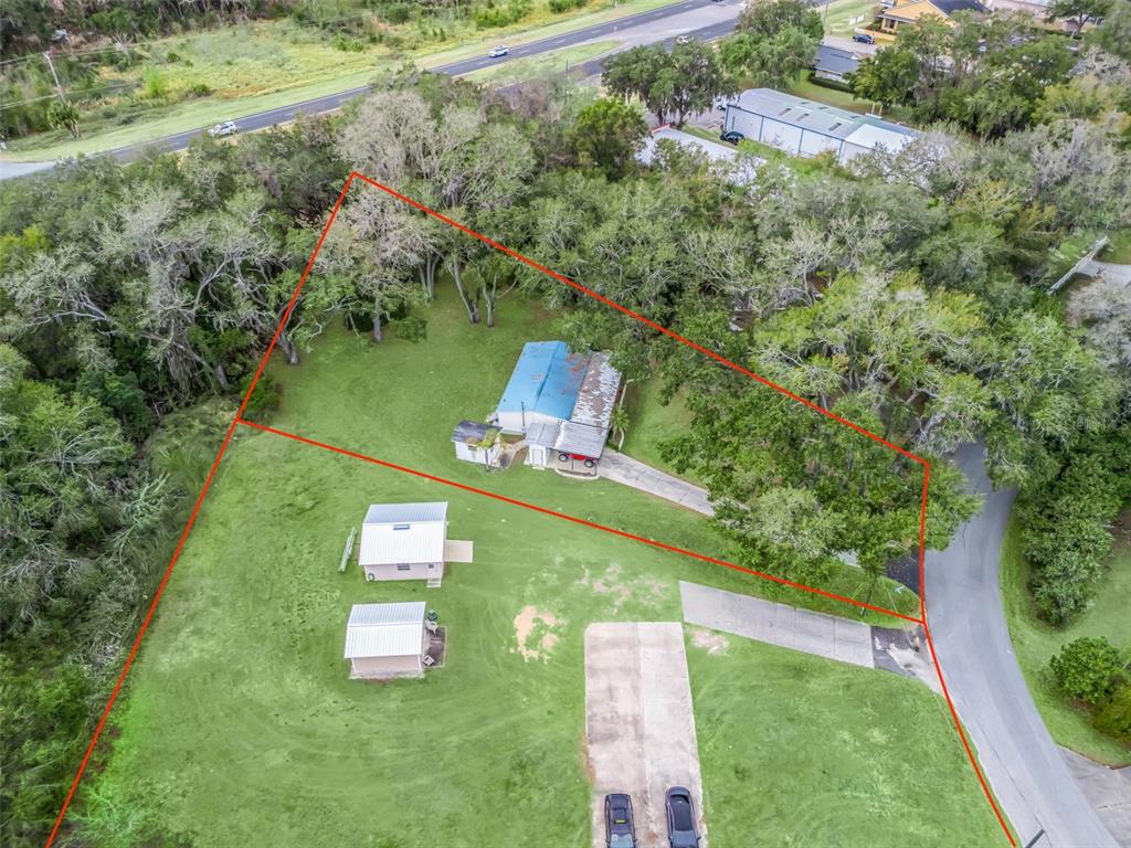 16160 Southeast 97th Terrace Road Summerfield, FL 34491 - Photo 37 of 39 an aerial view of a house with a yard