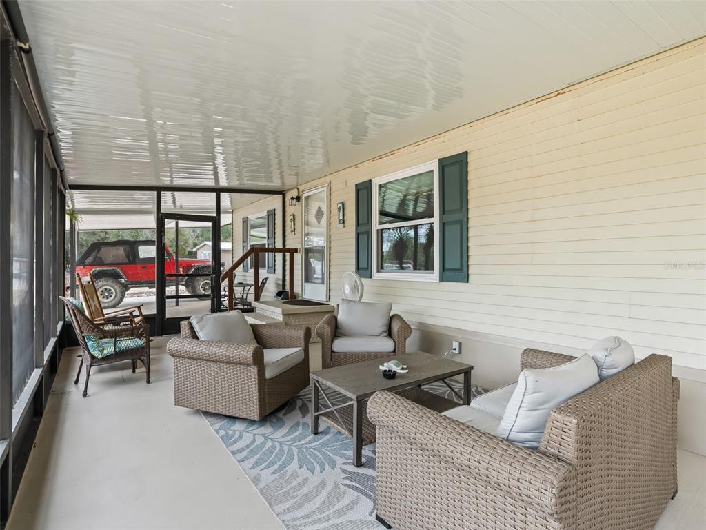 16160 Southeast 97th Terrace Road Summerfield, FL 34491 - Photo 6 of 39 a living room with furniture and a large window