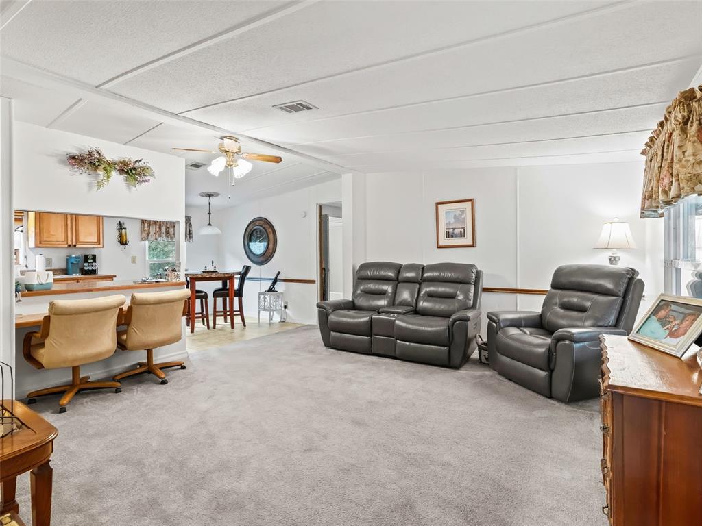 16160 Southeast 97th Terrace Road Summerfield, FL 34491 - Photo 7 of 39 a living room with furniture
