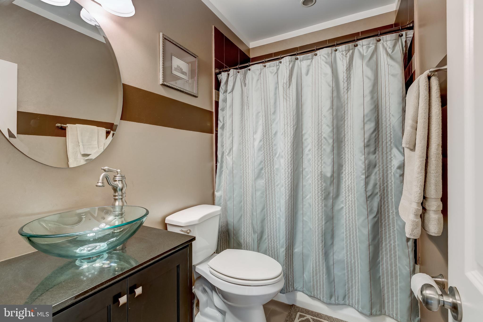 645 Aldershot Road Baltimore, MD 21229 - Photo 23 of 39 This is the hall bathroom with a super cool sink.