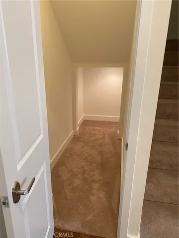 a view of staircase with white walls