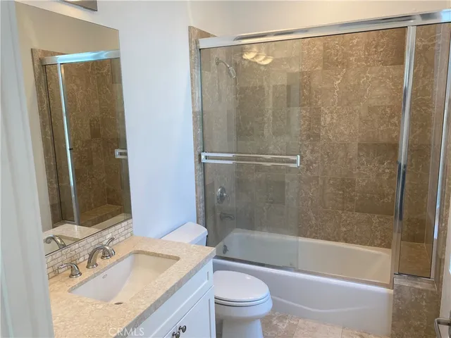 a view of a bathroom from a hallway