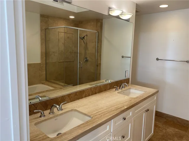 a bathroom with a tub and a shower
