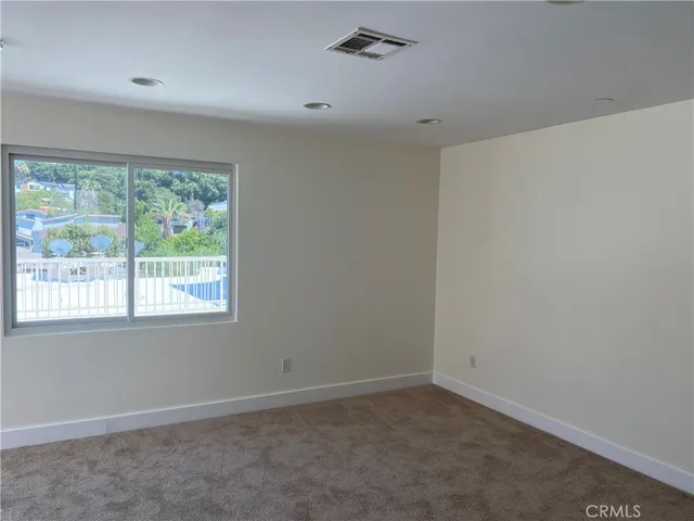 a view of an empty walk in closet