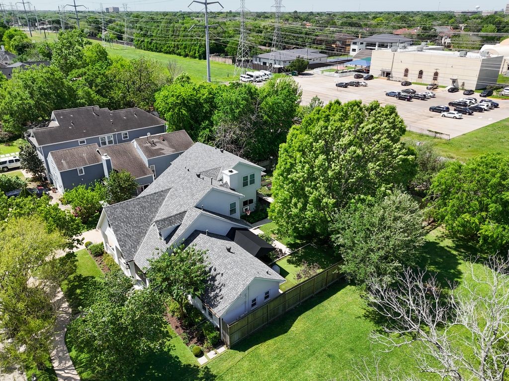6510 Community Drive Houston, TX 77005 - Photo 30 of 37 Aerial view of the home in the shadows of large mature trees.