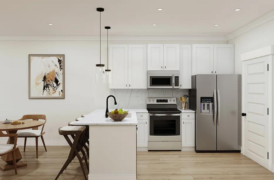 Lot 38 Sweethorn Street DeFuniak Springs, FL 32435 - Photo 3 of 29 a kitchen with stainless steel appliances a stove a refrigerator a sink a dining table and chairs