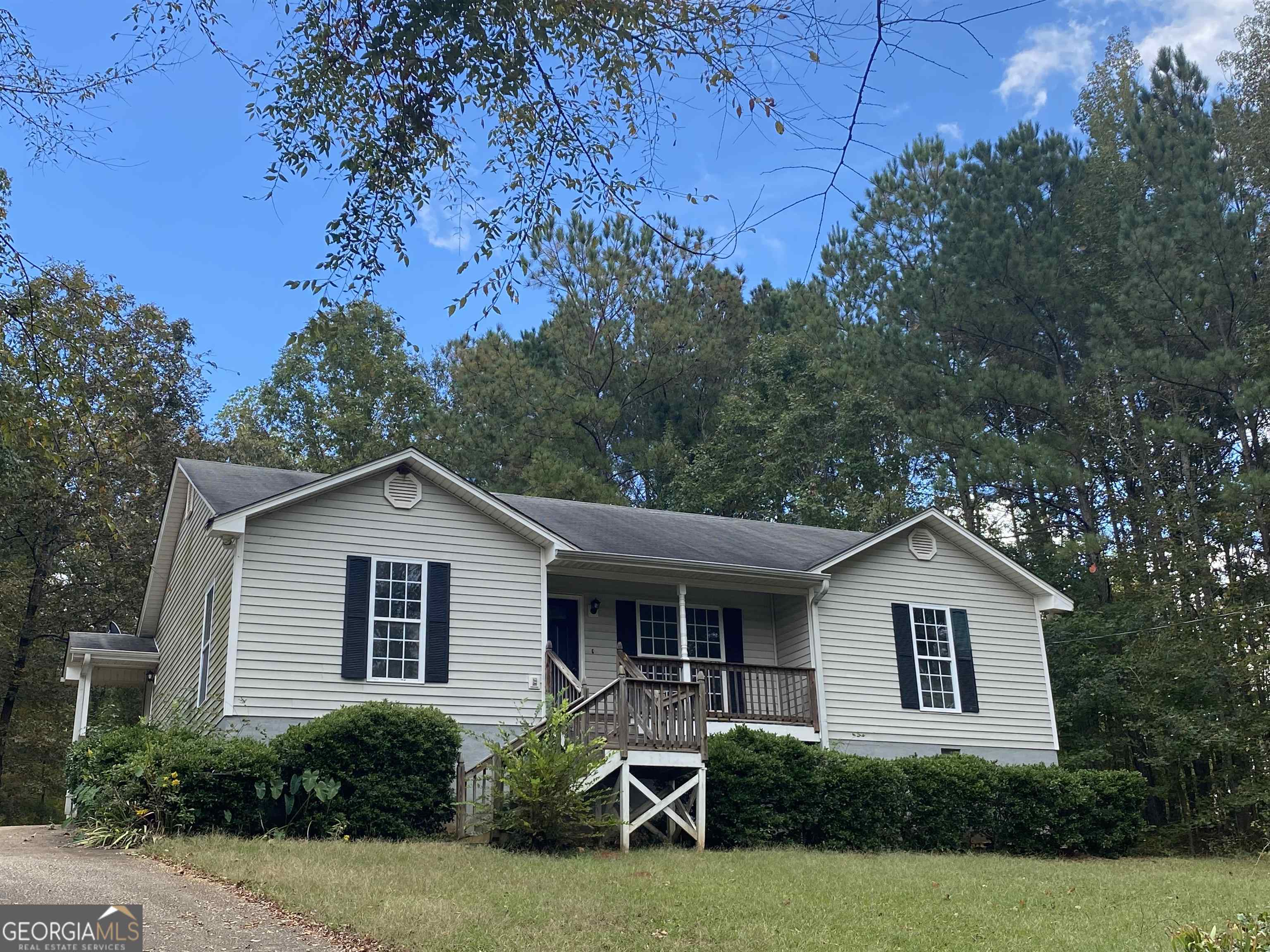 a house that has a tree in front of it