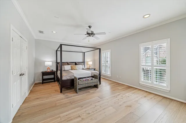 a view of a bedroom with wooden floor and staircase