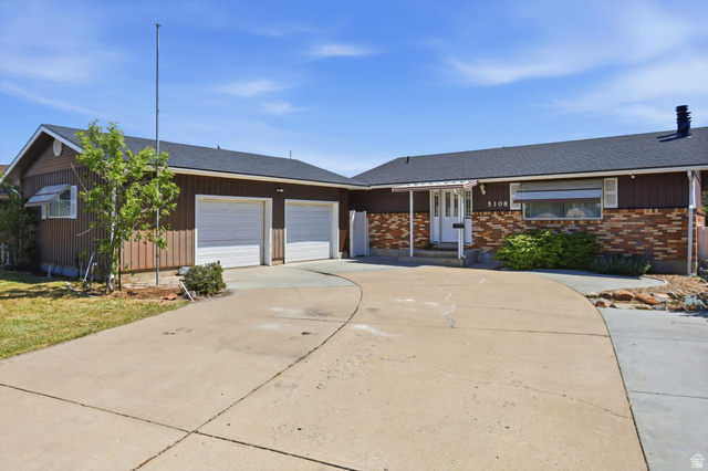 5108 South 2000th Street West Roy, UT 84067 - Photo 2 of 61 Ranch-style house with roof with shingles, a garage, driveway, and brick siding