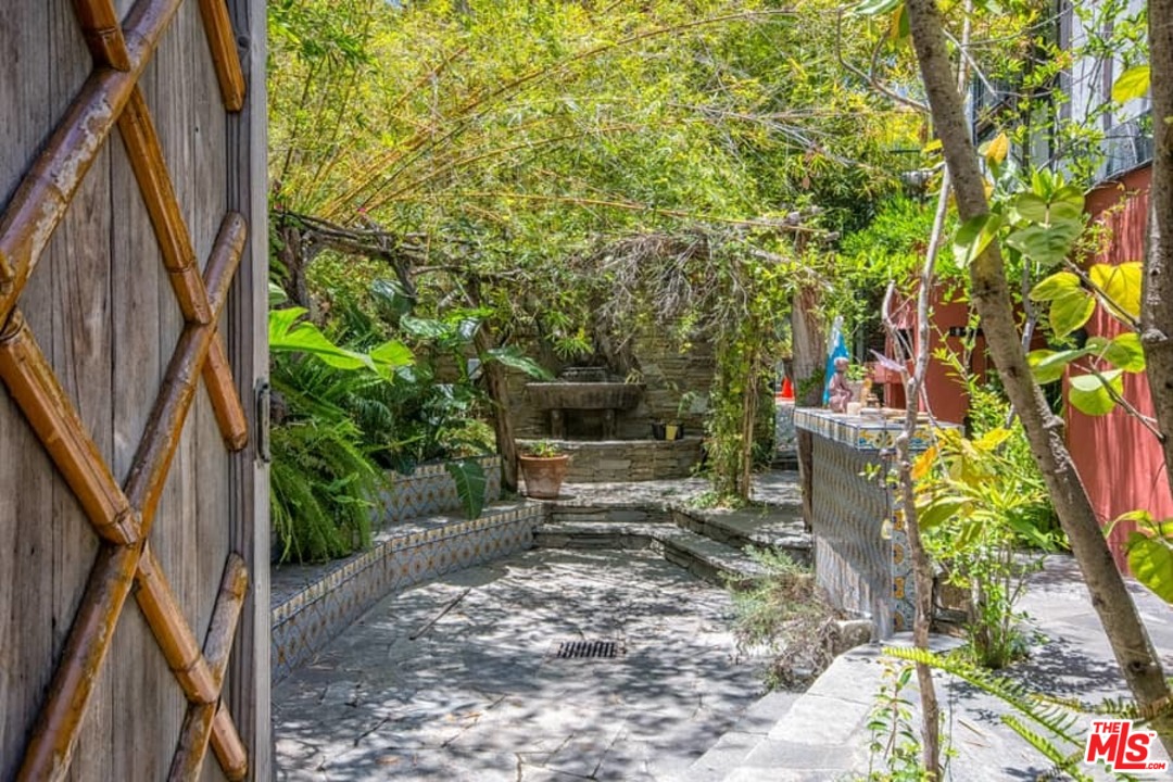 613 North Arden Drive Beverly Hills, CA 90210 - Photo 11 of 25 a view of a garden with sitting area