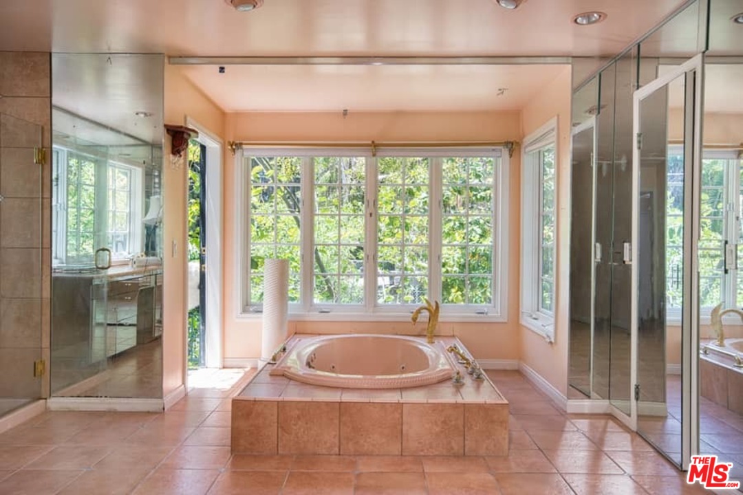 613 North Arden Drive Beverly Hills, CA 90210 - Photo 15 of 25 a spacious bathroom with a tub and shower
