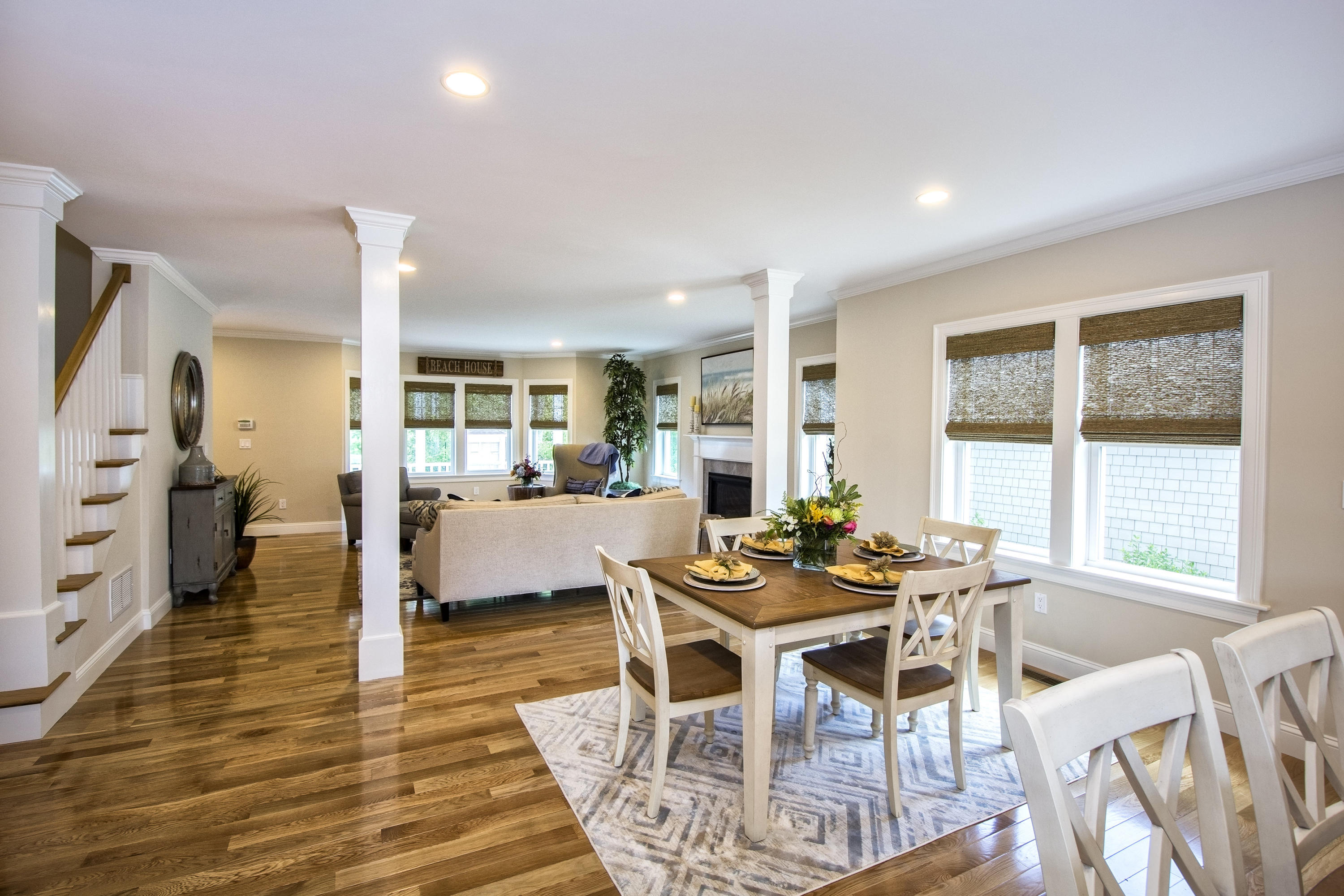 a dining room with furniture and wooden floor