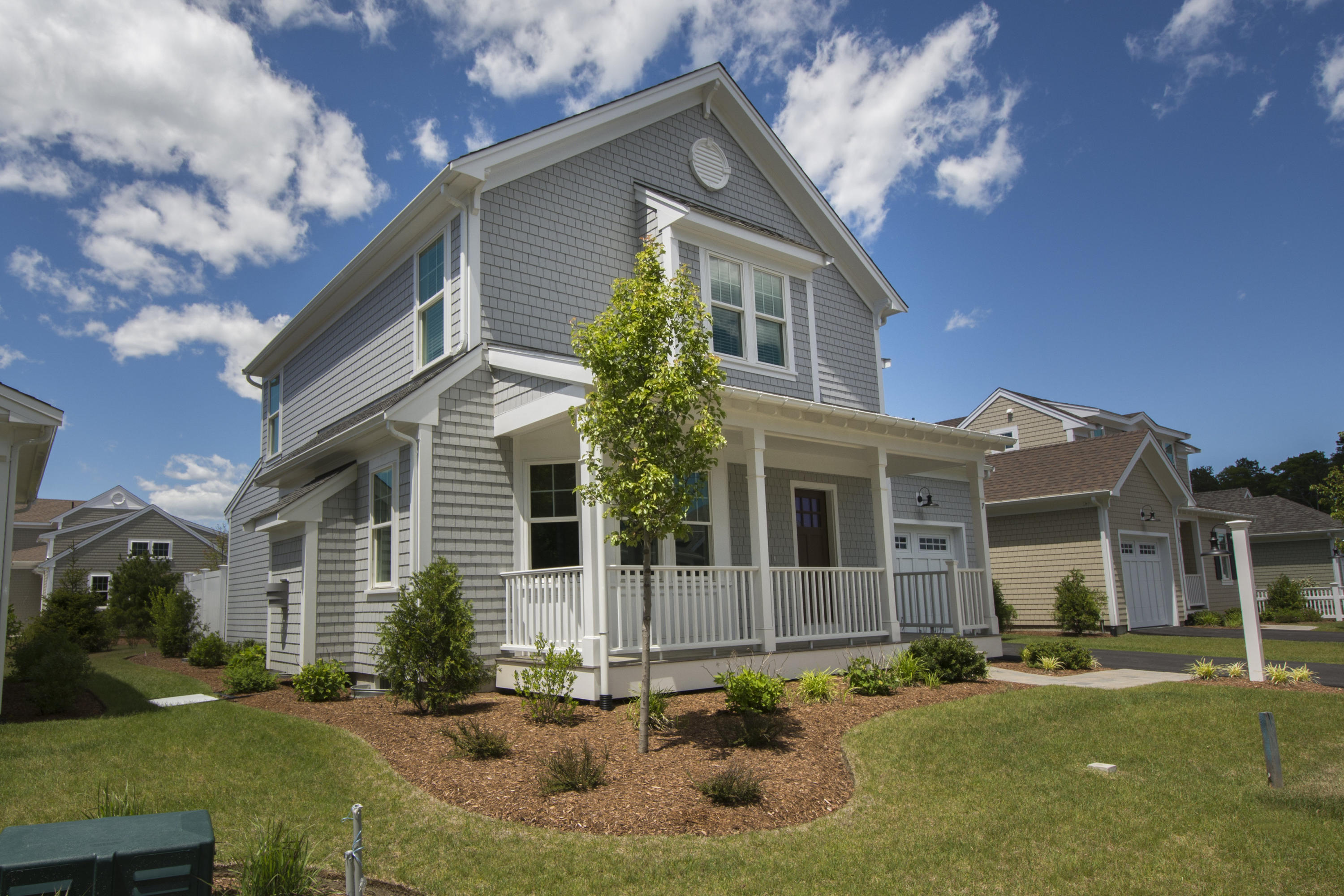 67 Cobblestone Circle Mashpee, MA 02649 - Photo 20 of 38 a front view of a house with a yard