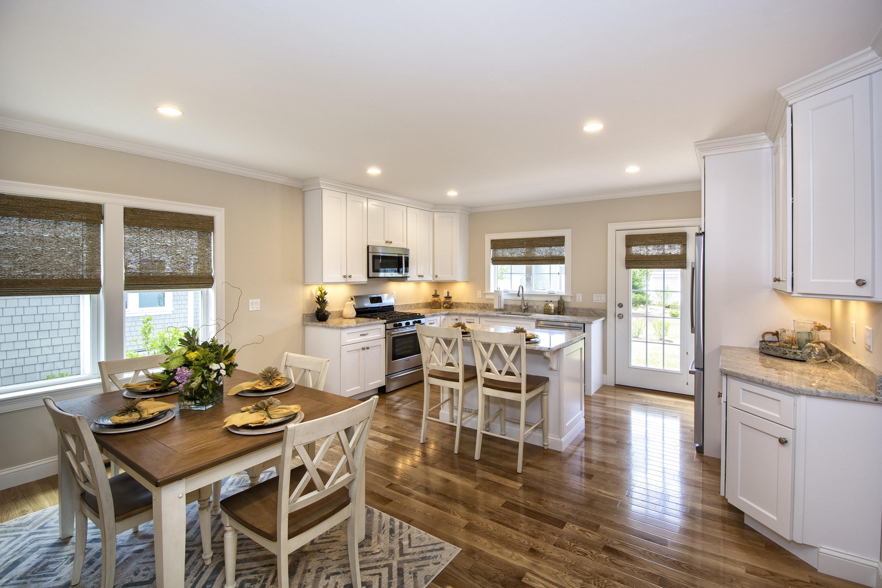 67 Cobblestone Circle Mashpee, MA 02649 - Photo 5 of 38 a view of a dining room with furniture and wooden floor