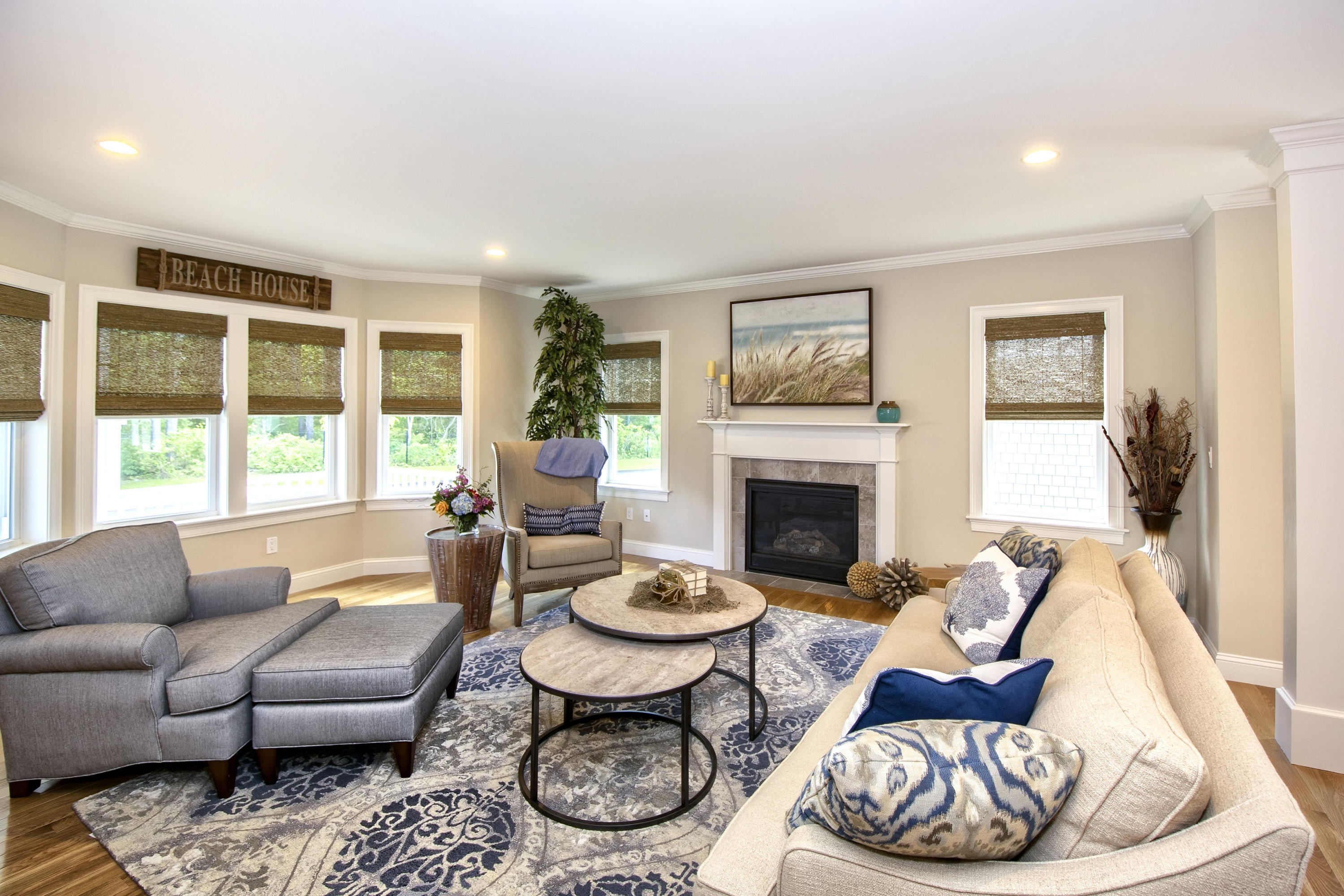67 Cobblestone Circle Mashpee, MA 02649 - Photo 6 of 38 a living room with furniture a fireplace and a large window