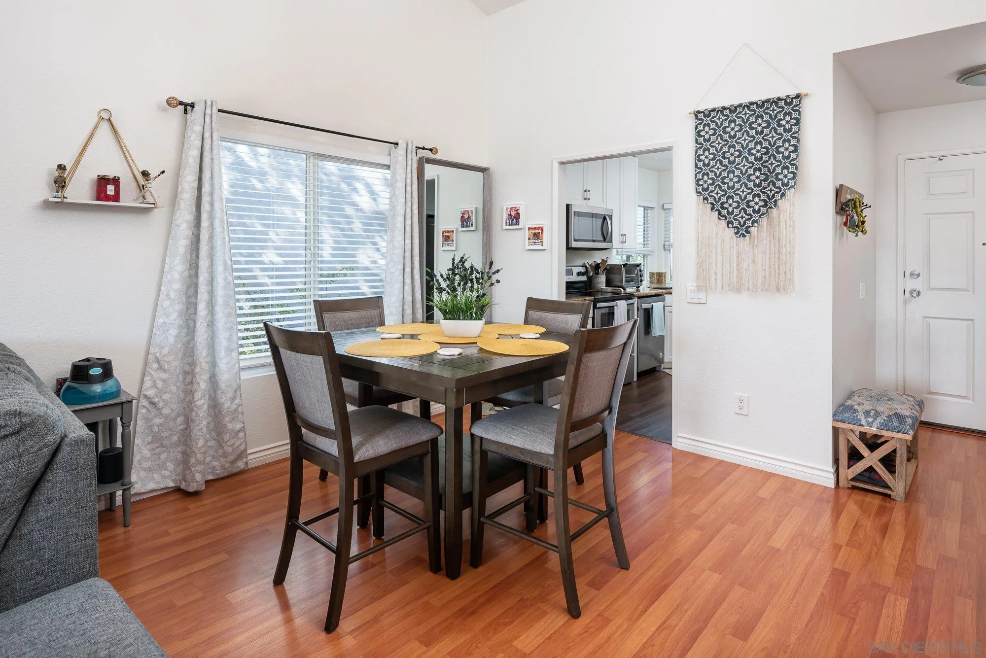 323 Windjammer Circle Chula Vista, CA 91910 - Photo 12 of 27 a view of a dining room with furniture and wooden floor