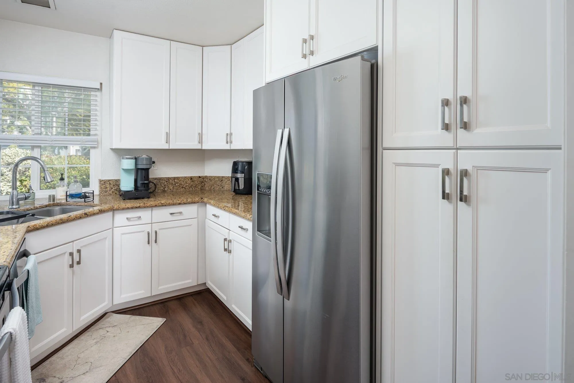 323 Windjammer Circle Chula Vista, CA 91910 - Photo 14 of 27 a white refrigerator freezer sitting inside of a kitchen