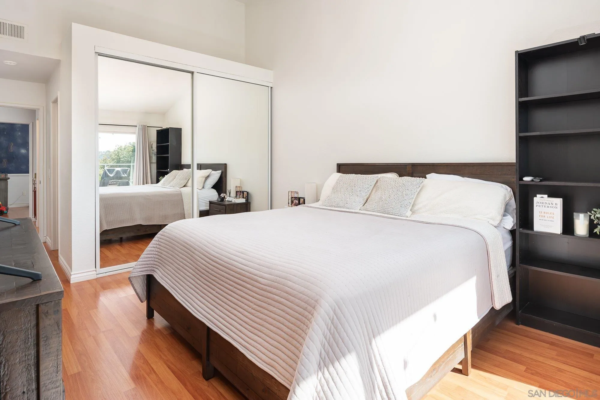 323 Windjammer Circle Chula Vista, CA 91910 - Photo 16 of 27 a bedroom with bed and large window