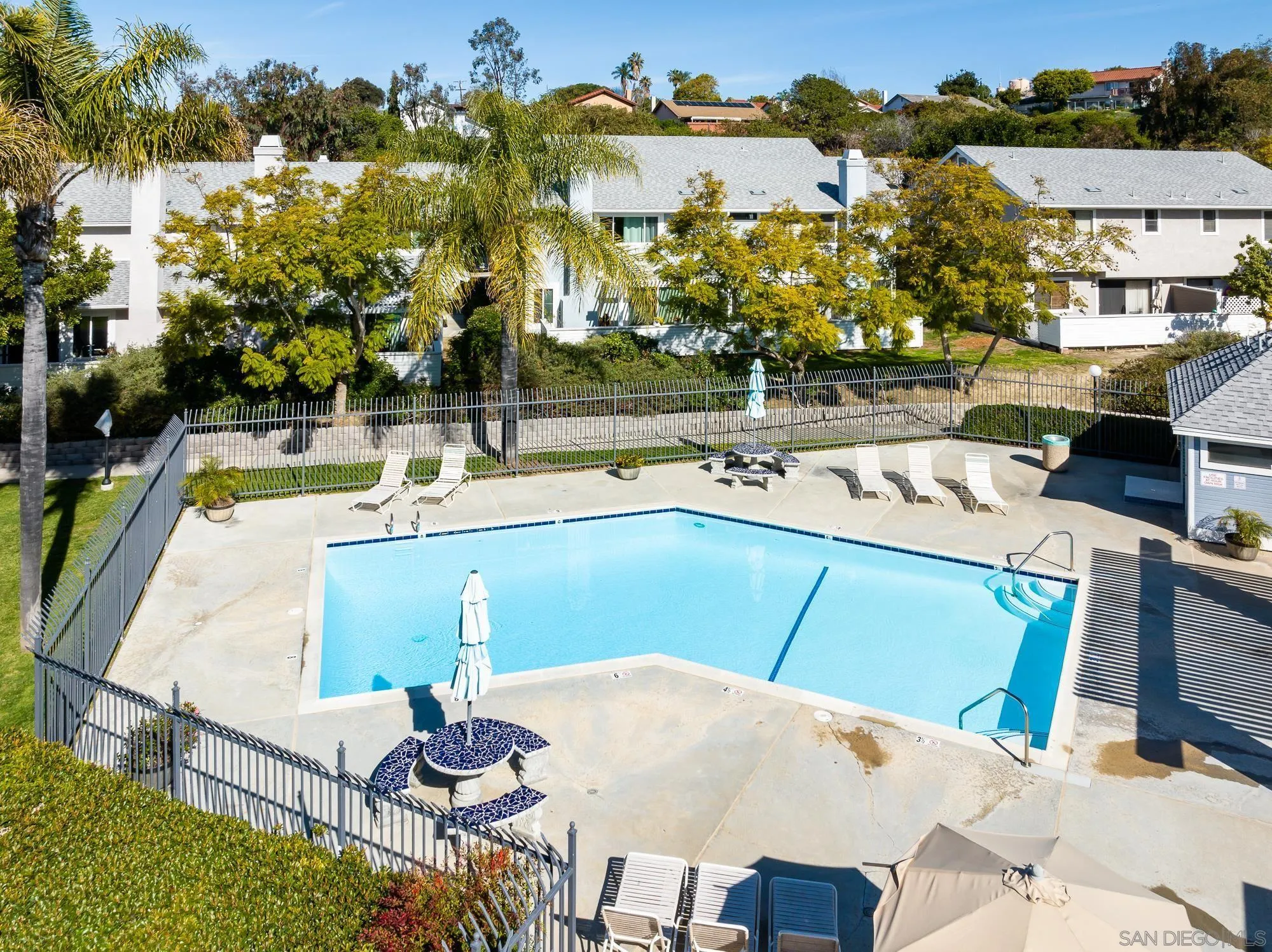 323 Windjammer Circle Chula Vista, CA 91910 - Photo 20 of 27 a view of a swimming pool with a patio and a yard