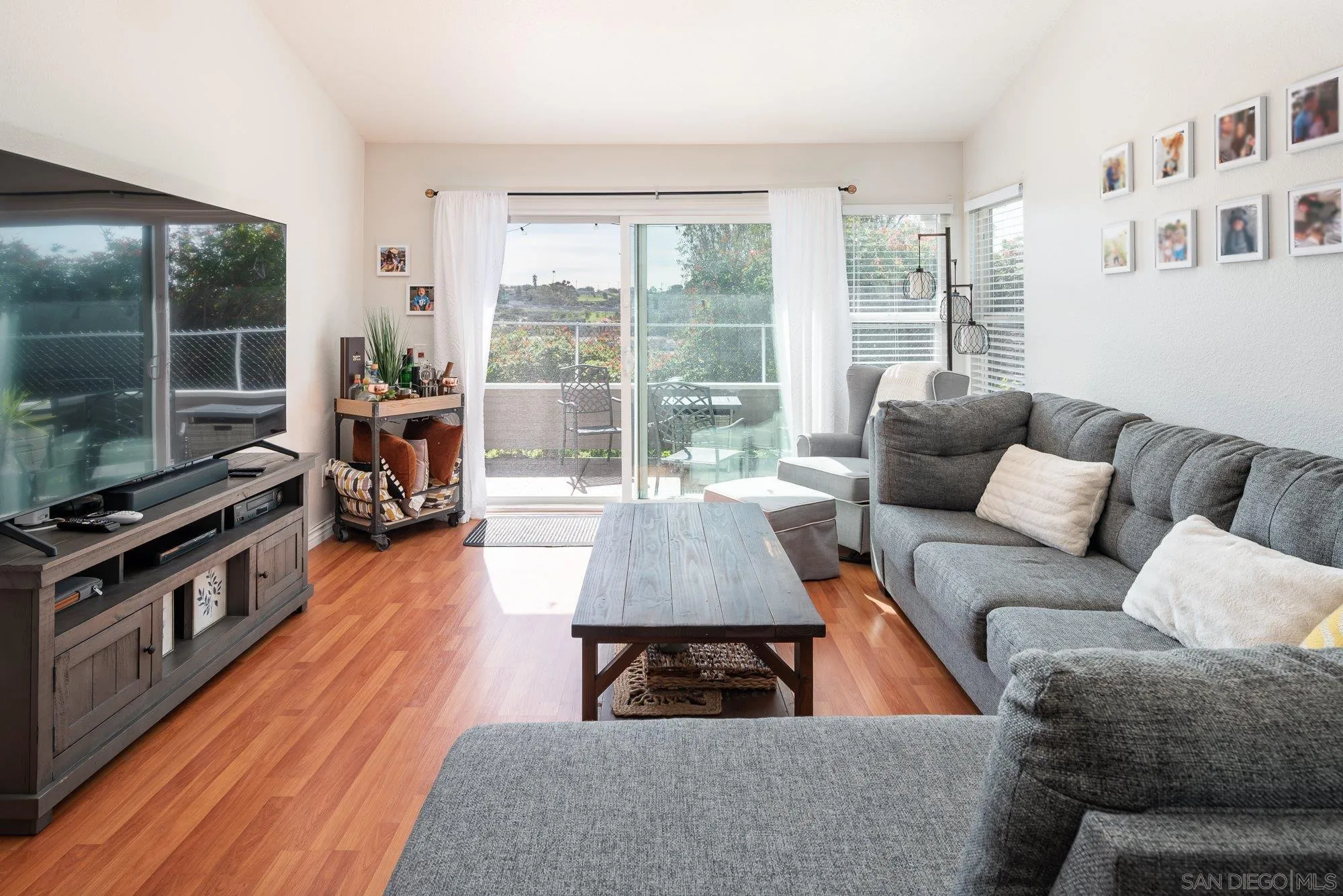 323 Windjammer Circle Chula Vista, CA 91910 - Photo 7 of 27 a living room with furniture and a flat screen tv