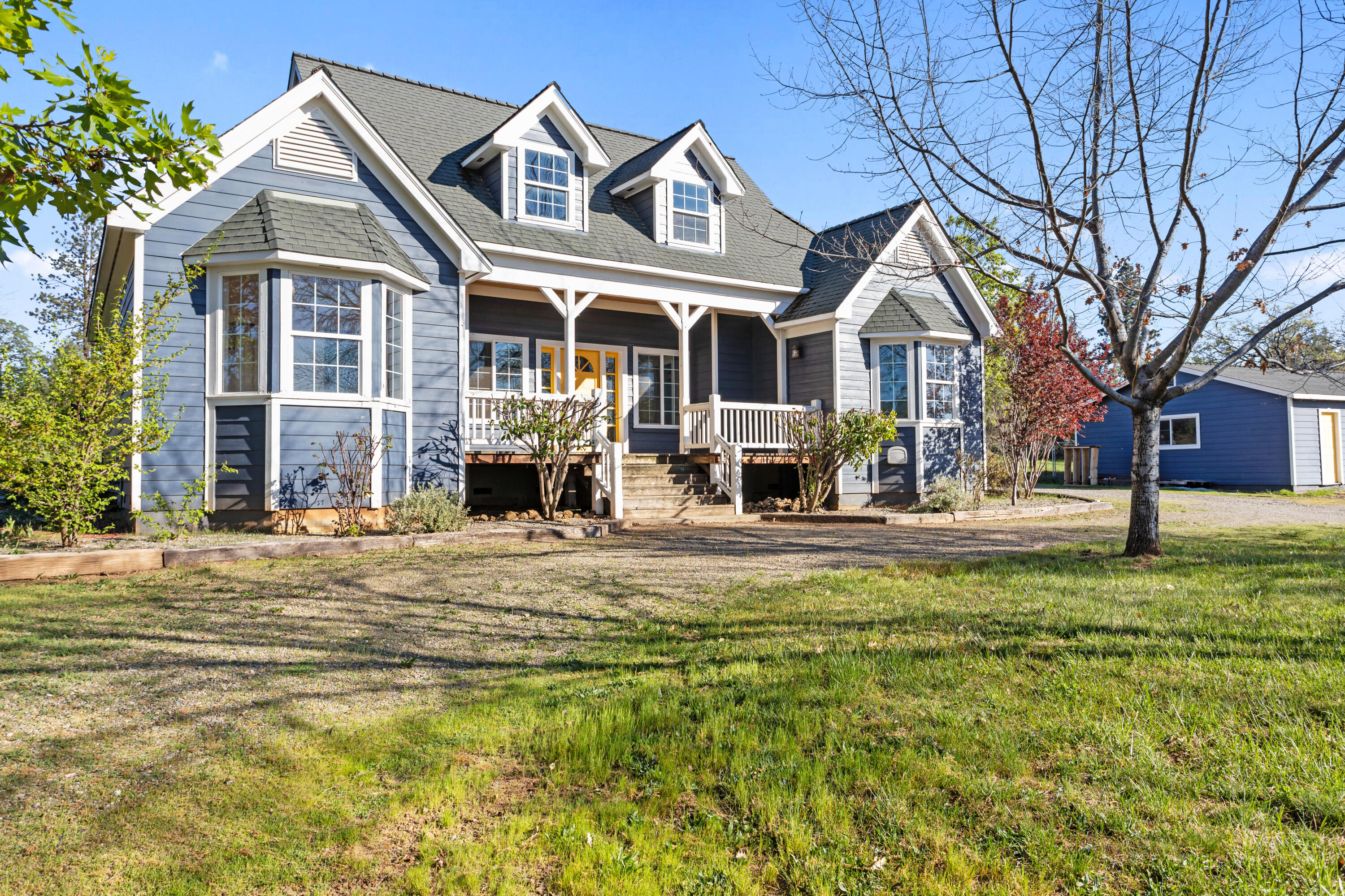 a front view of a house with a yard