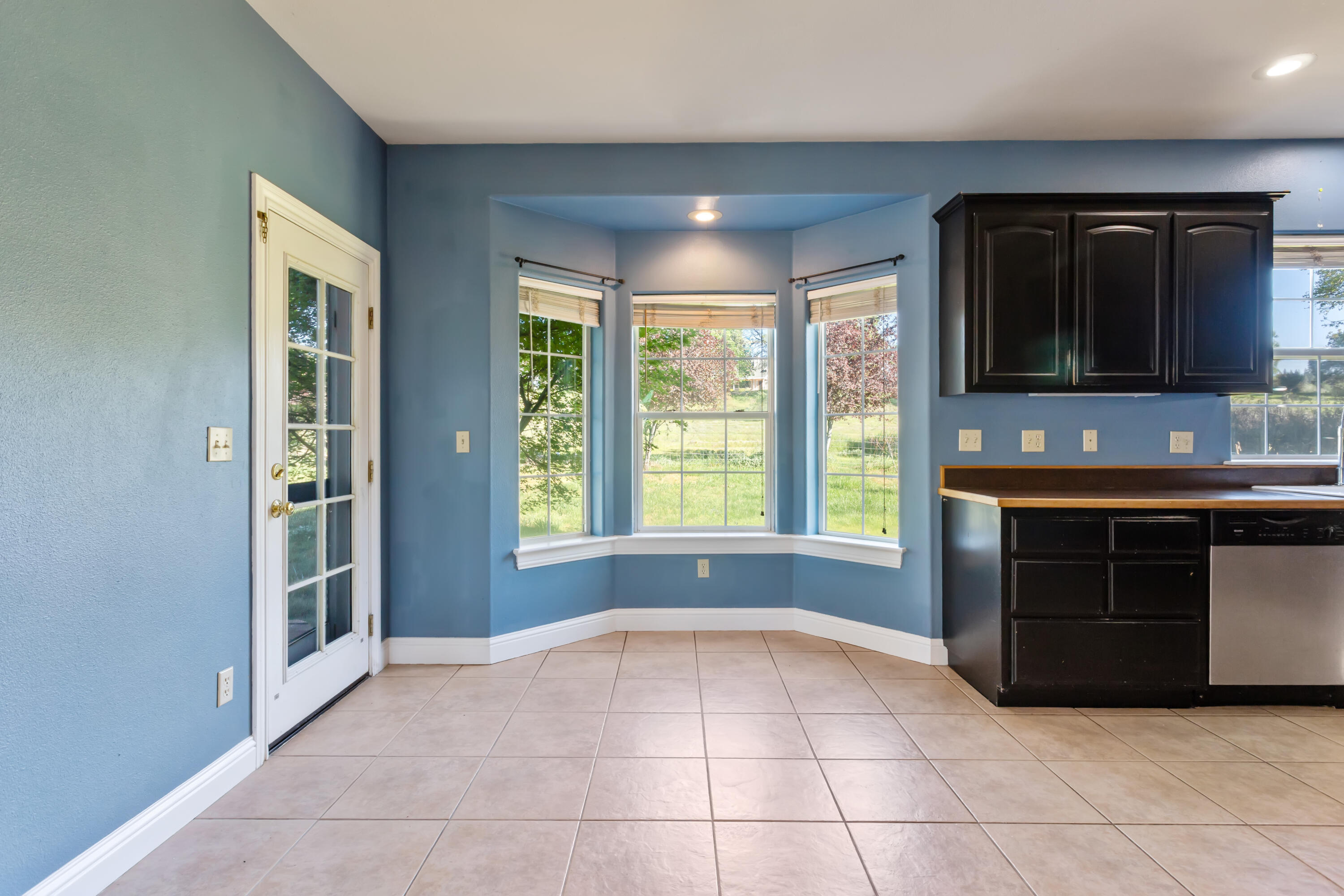 32211 Rock Creek Road Manton, CA 96059 - Photo 11 of 35 a view of kitchen with granite countertop cabinets and black stainless steel appliances