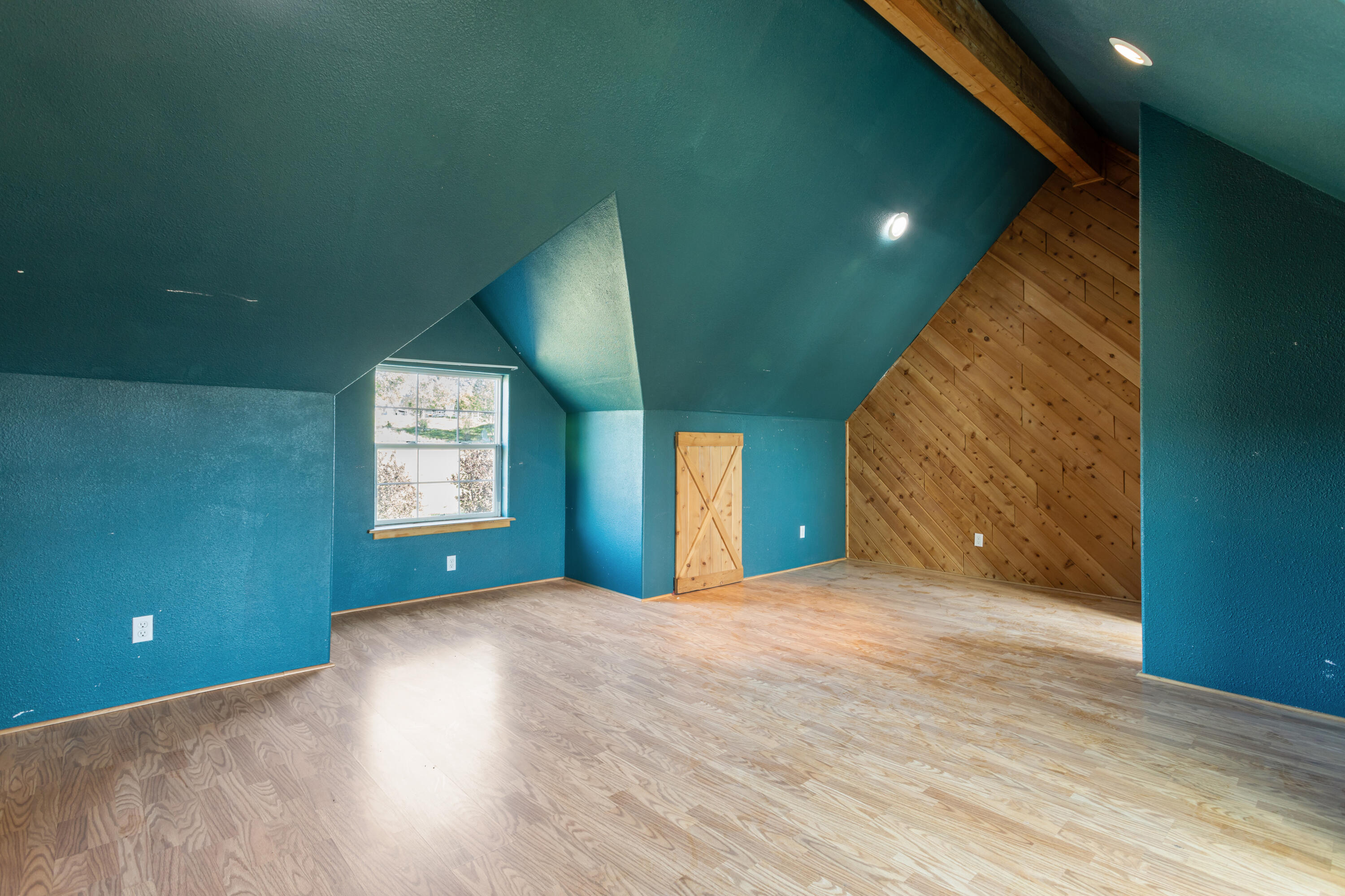 32211 Rock Creek Road Manton, CA 96059 - Photo 23 of 35 a view of an empty room with window and wooden floor