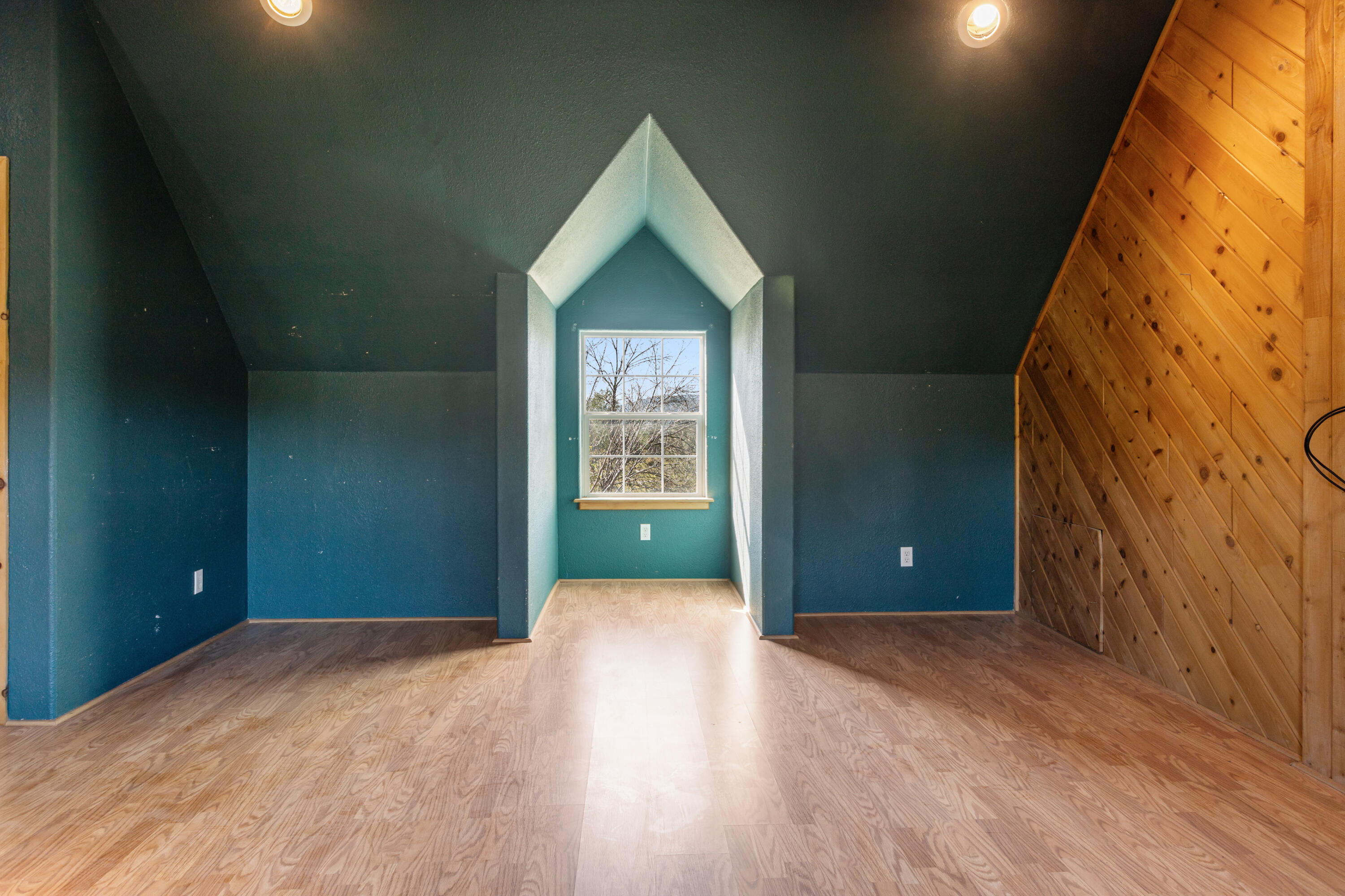 32211 Rock Creek Road Manton, CA 96059 - Photo 24 of 35 a view of a livingroom with wooden floor and a window