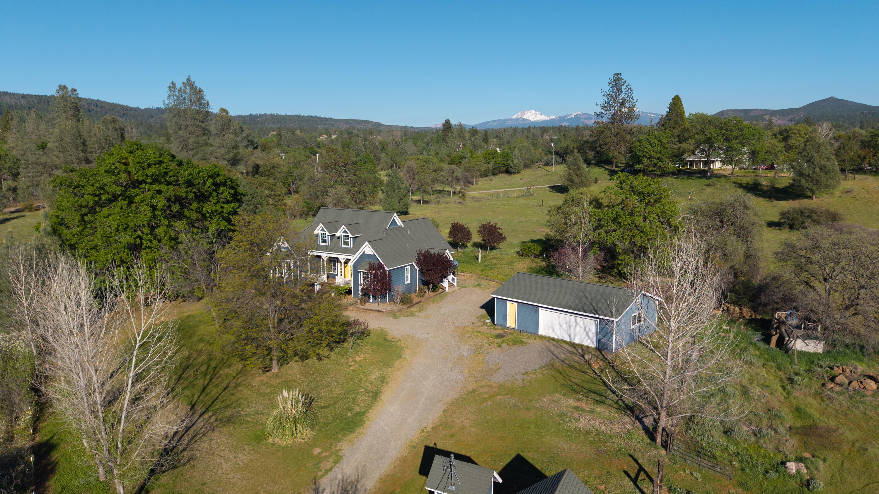 32211 Rock Creek Road Manton, CA 96059 - Photo 25 of 35 a view of a city with mountains in the background