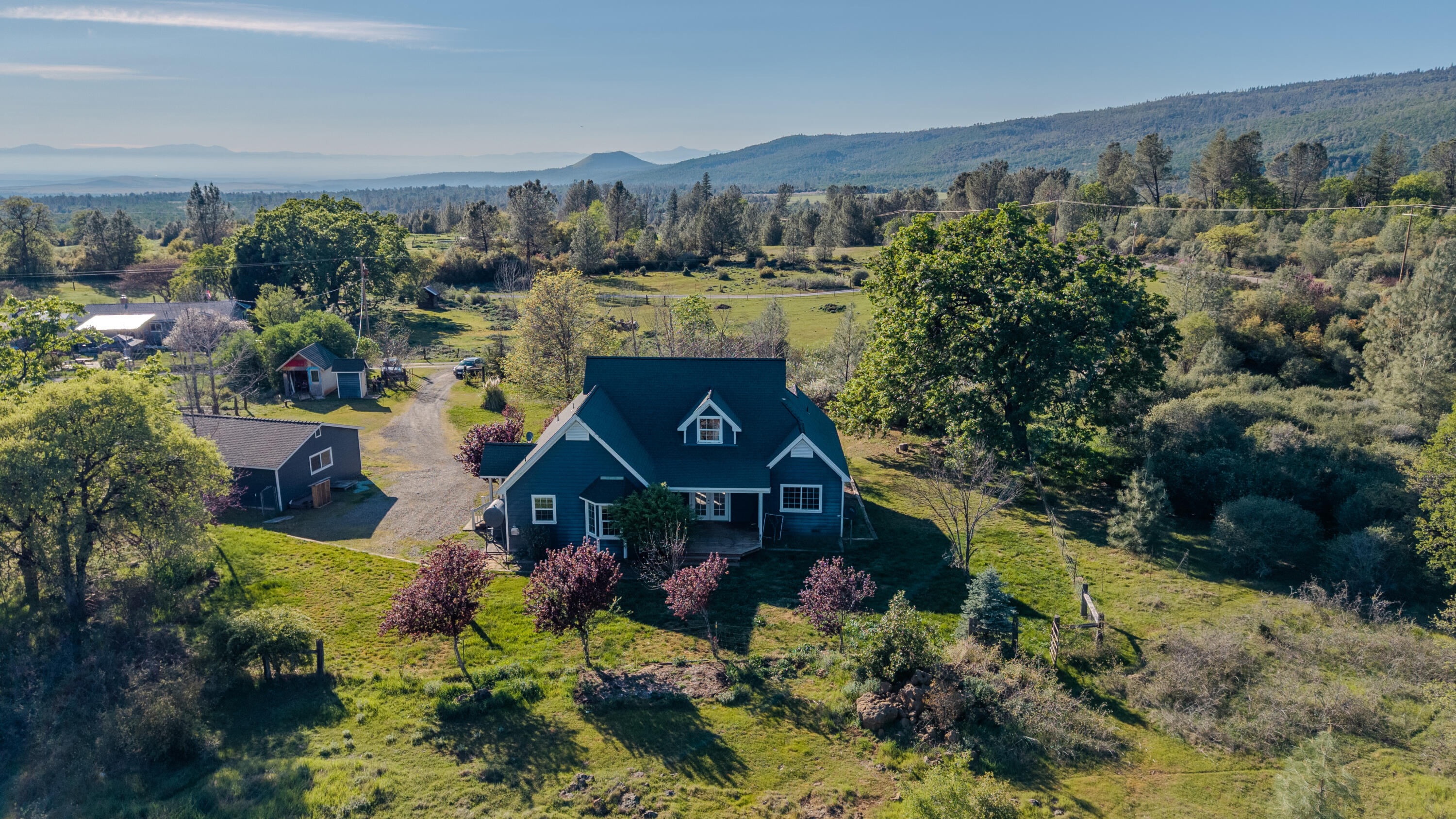 32211 Rock Creek Road Manton, CA 96059 - Photo 28 of 35 a view of a house with a yard and garden