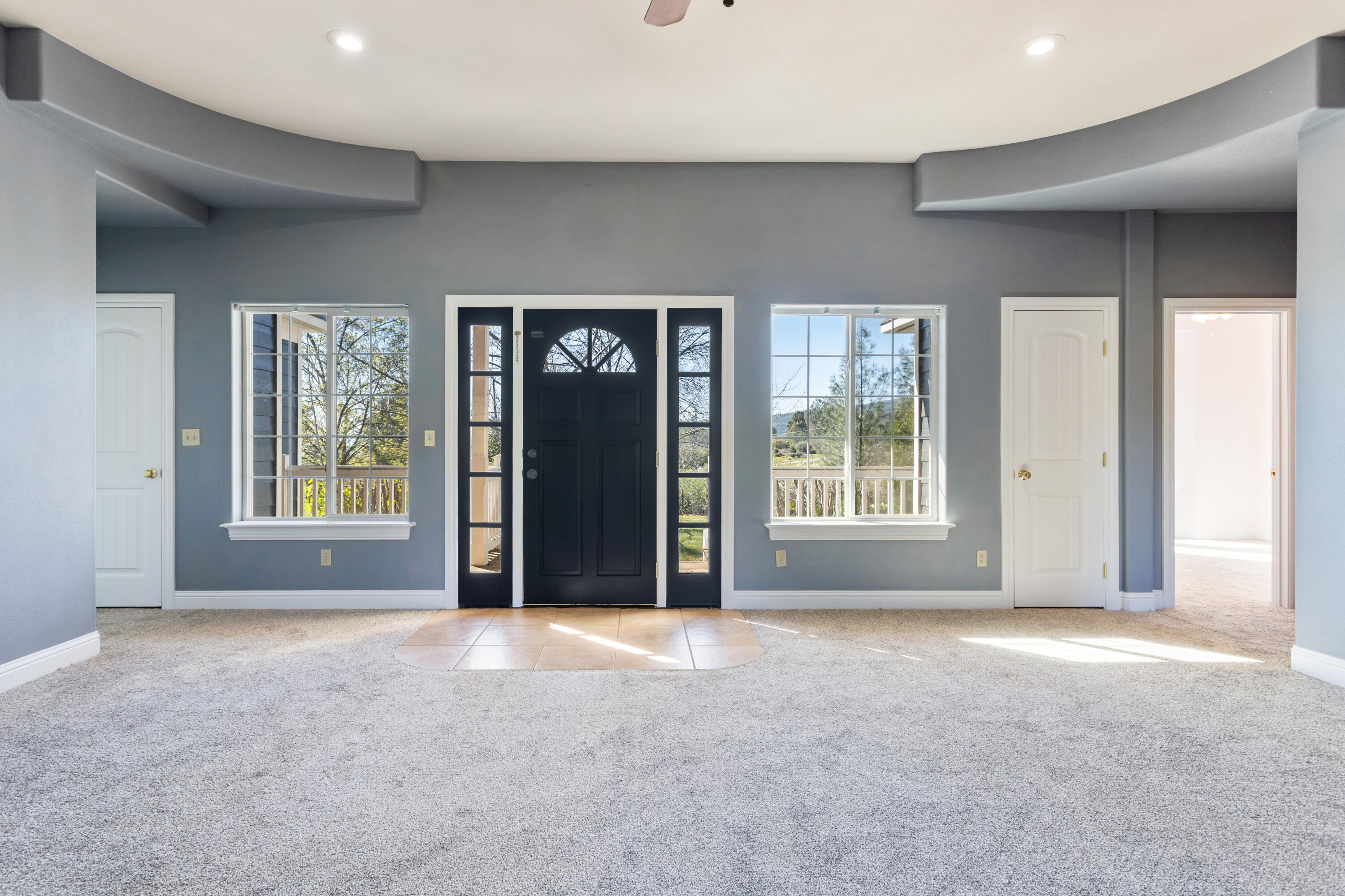 32211 Rock Creek Road Manton, CA 96059 - Photo 5 of 35 a view of a big room with windows and chandelier