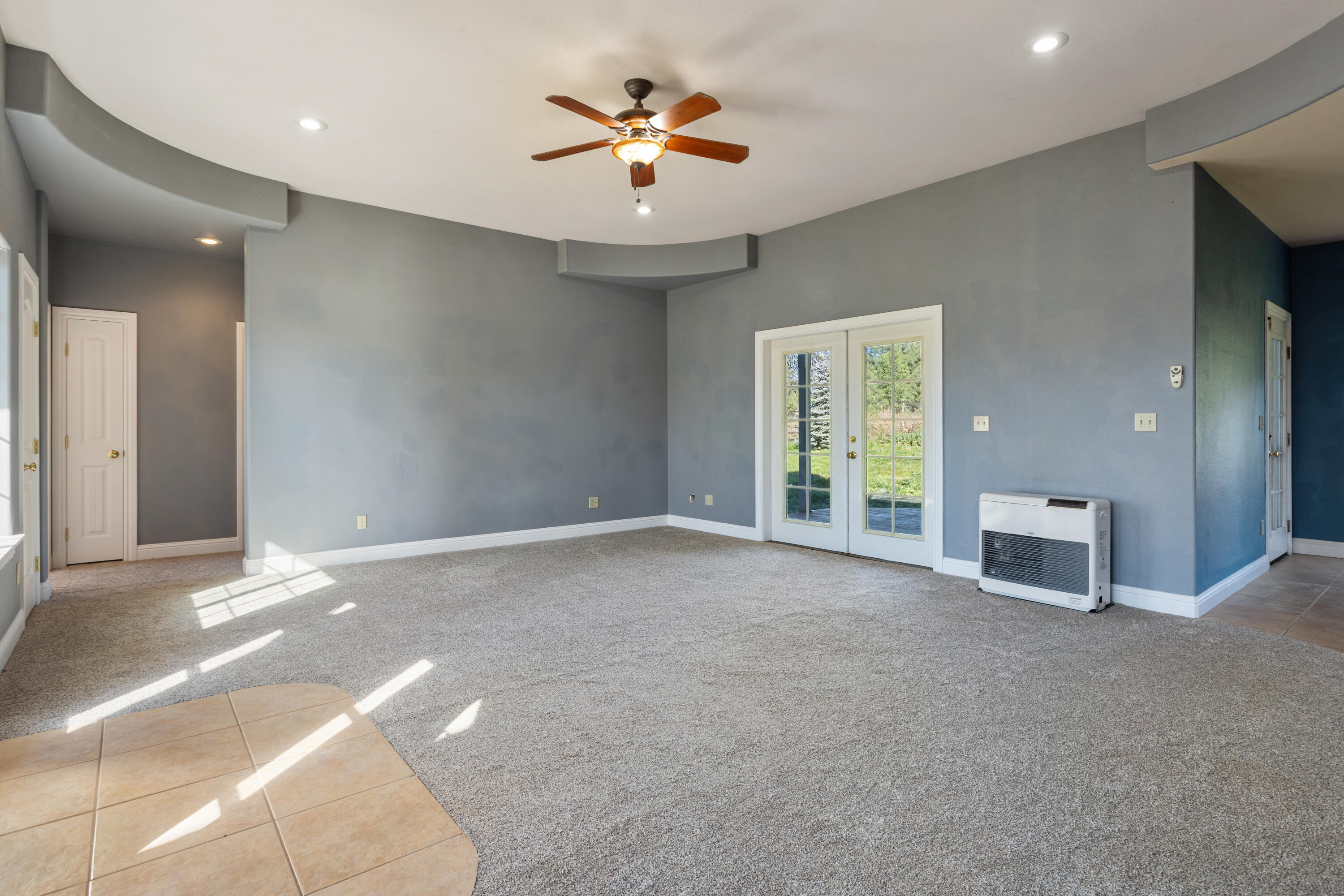 32211 Rock Creek Road Manton, CA 96059 - Photo 7 of 35 a view of a livingroom with a ceiling fan and window