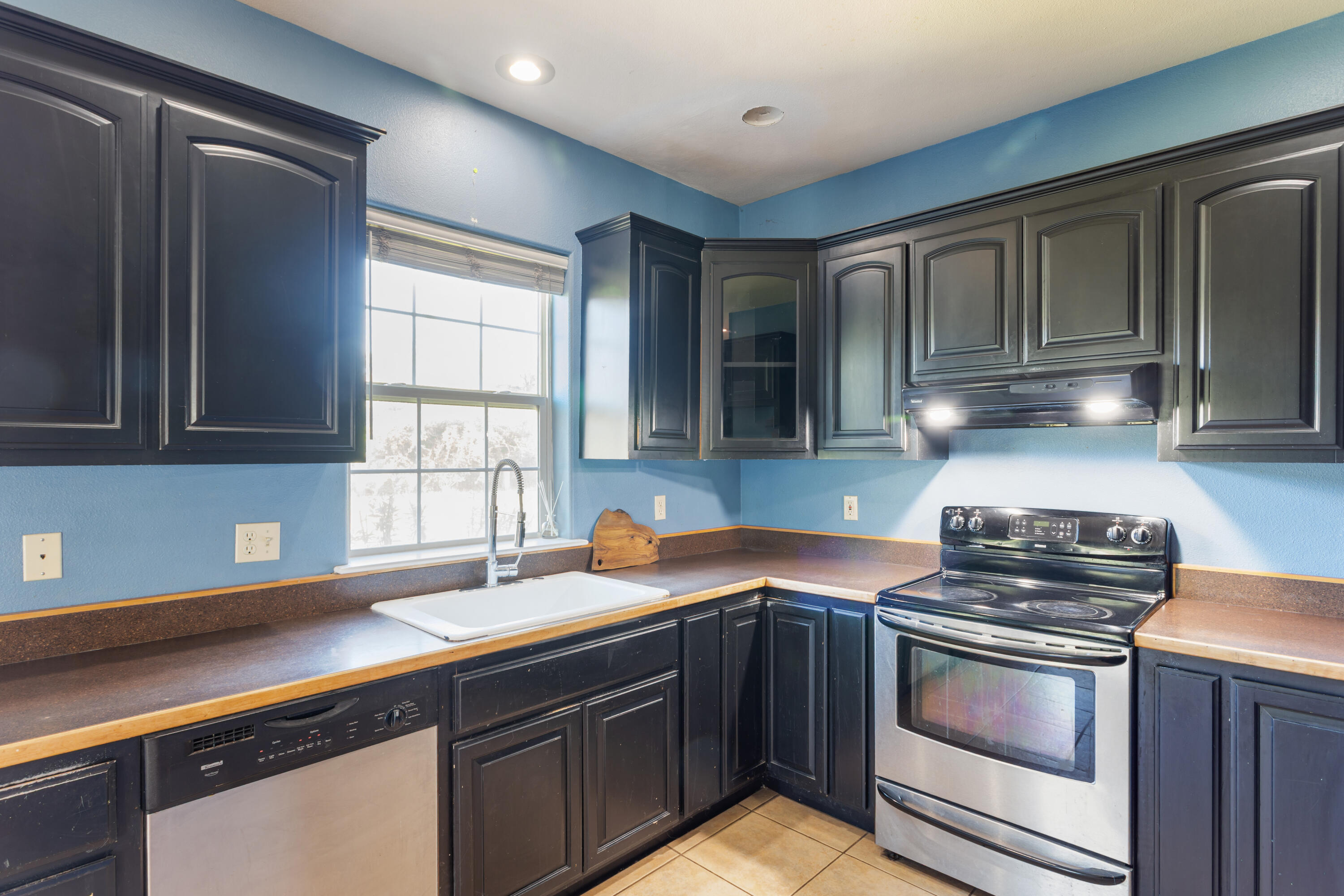 32211 Rock Creek Road Manton, CA 96059 - Photo 10 of 35 a kitchen with stainless steel appliances granite countertop a sink stove and cabinets