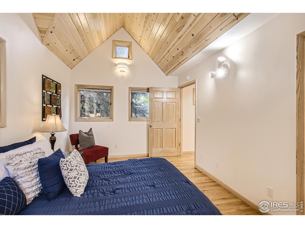 520 Mapleton Avenue Boulder, CO 80302 - Photo 11 of 24 a bedroom with furniture and a window