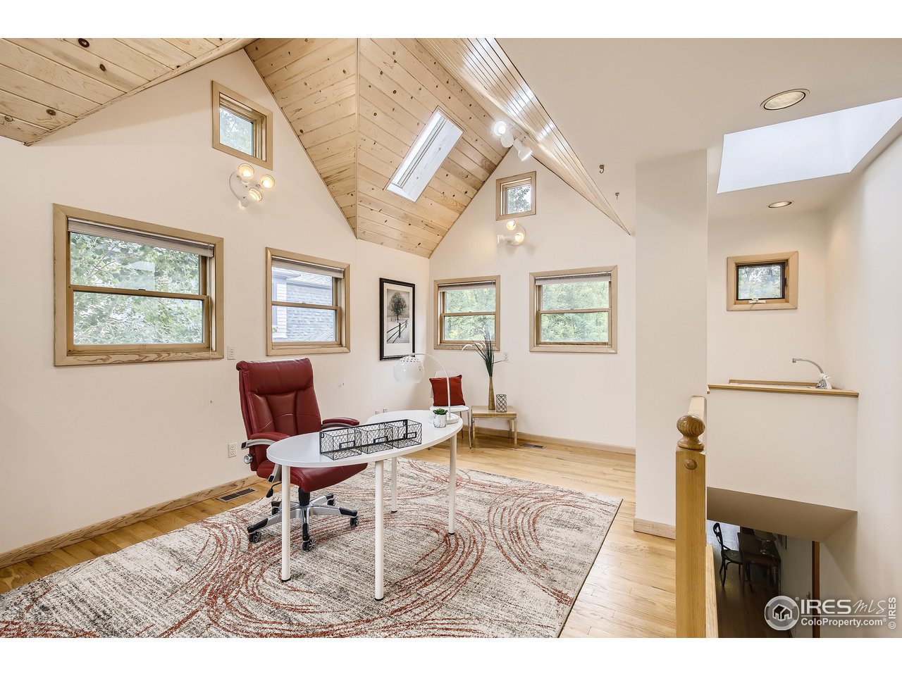 520 Mapleton Avenue Boulder, CO 80302 - Photo 13 of 24 a living room with furniture and a window