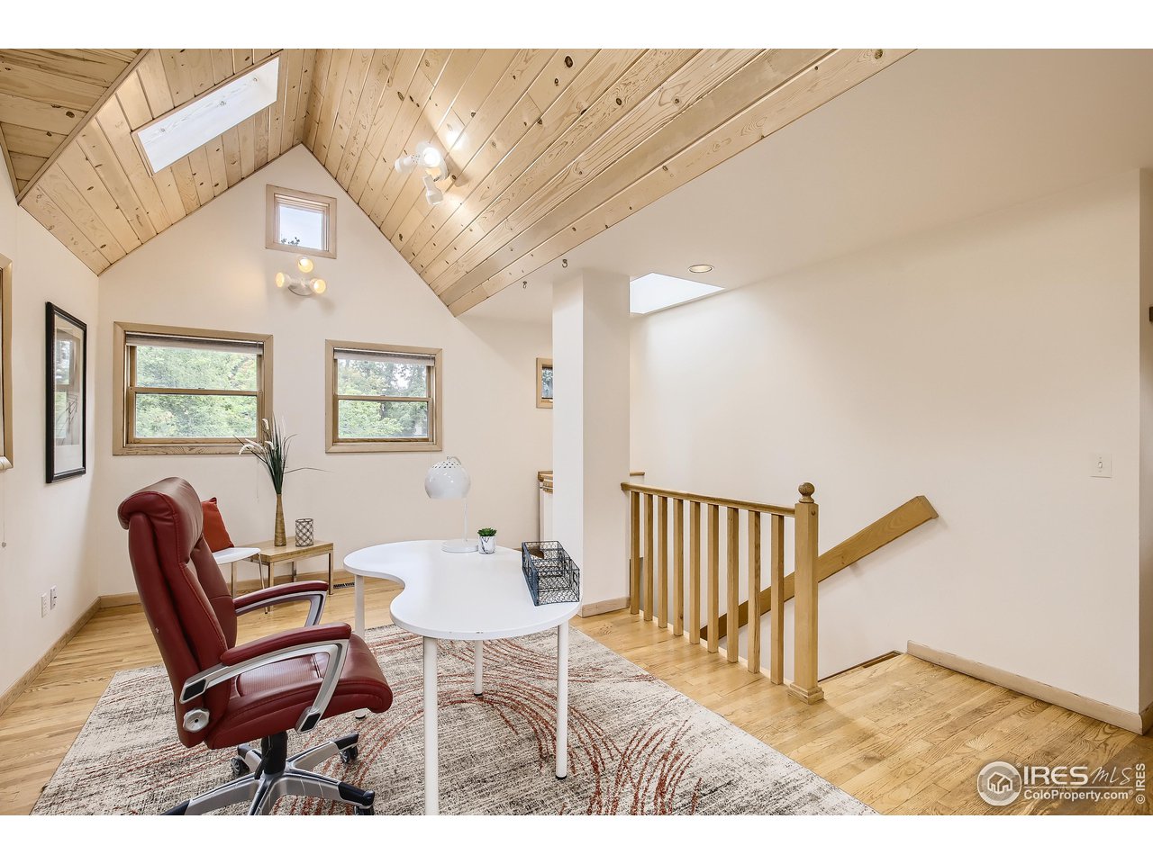 520 Mapleton Avenue Boulder, CO 80302 - Photo 14 of 24 a living room with furniture and a wooden floor