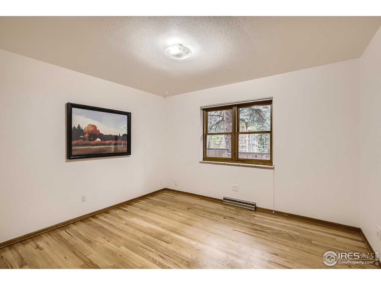 520 Mapleton Avenue Boulder, CO 80302 - Photo 18 of 24 a view of an empty room with a window