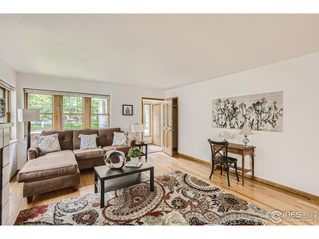 520 Mapleton Avenue Boulder, CO 80302 - Photo 5 of 24 a living room with furniture a rug and a window