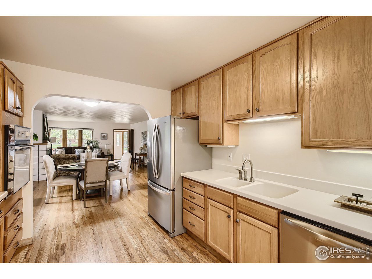 520 Mapleton Avenue Boulder, CO 80302 - Photo 8 of 24 a kitchen with cabinets and wooden floors