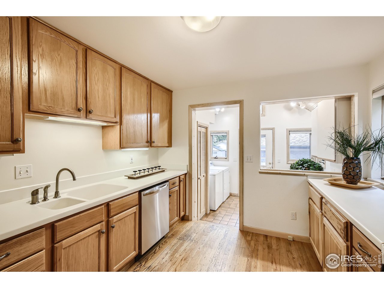 520 Mapleton Avenue Boulder, CO 80302 - Photo 10 of 24 a kitchen with stainless steel appliances granite countertop a sink stove and cabinets