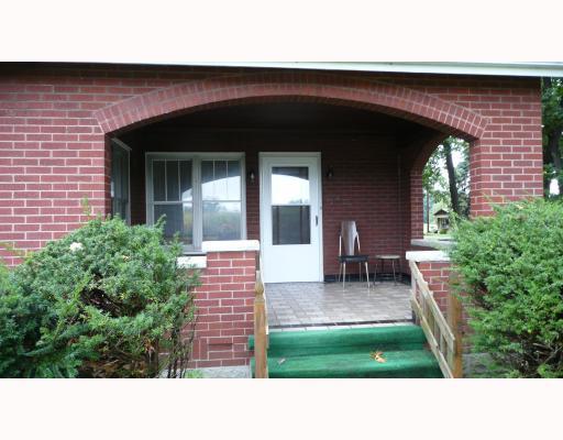 1062 Herman Road Butler, PA 16002 - Photo 18 of 18 Exterior Front. Well crafted front porch with ceramic tile flooring for spending eveinings watching the corn grow across the road